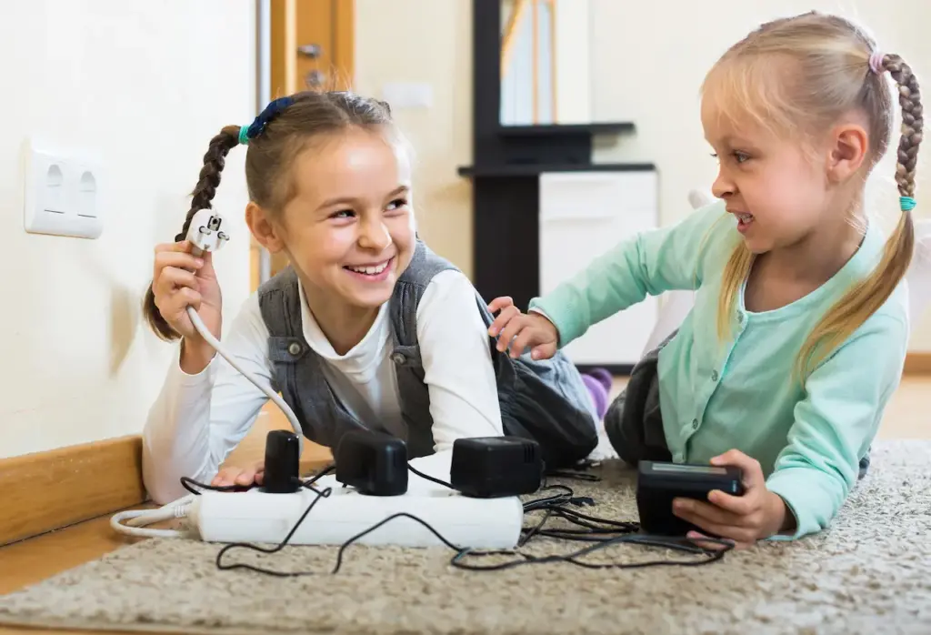 Children Playing with Sockets and Electricity 