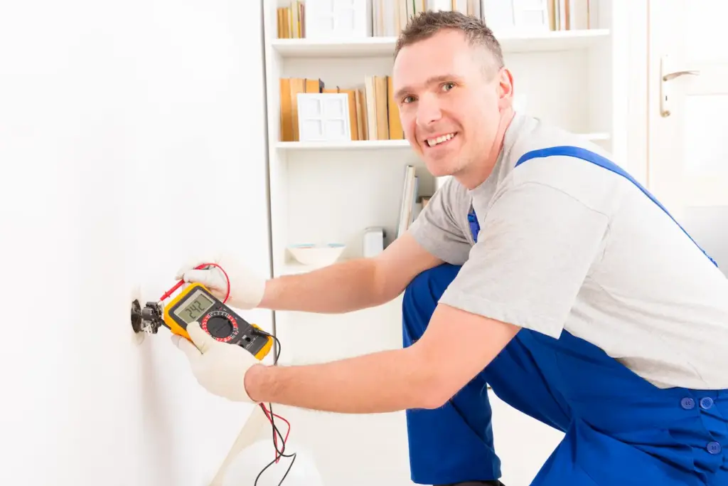 Electrician Checking the Outlet Voltages 