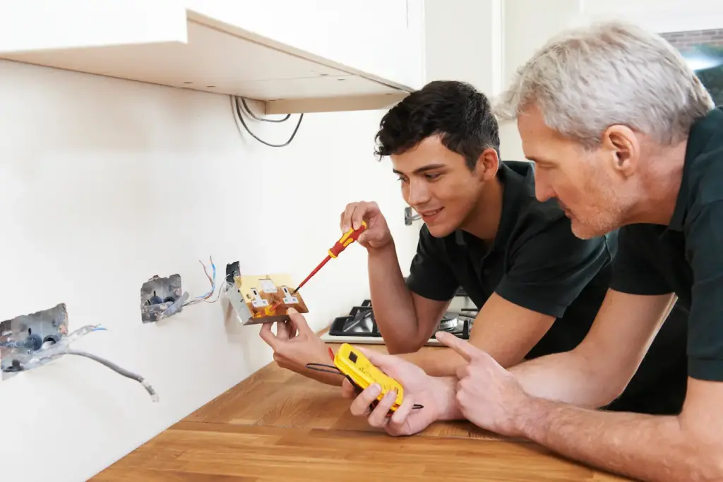 Electrician Fixing and Installing Outlets 