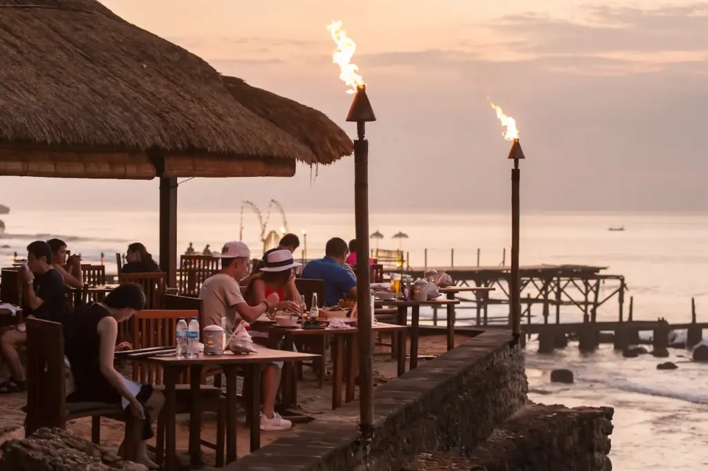 Tourist Eating in the Famous Rock Bar on Bali