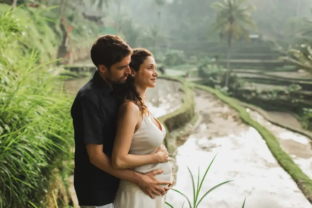 Pregnant Women with his Husband Hugging Each Other